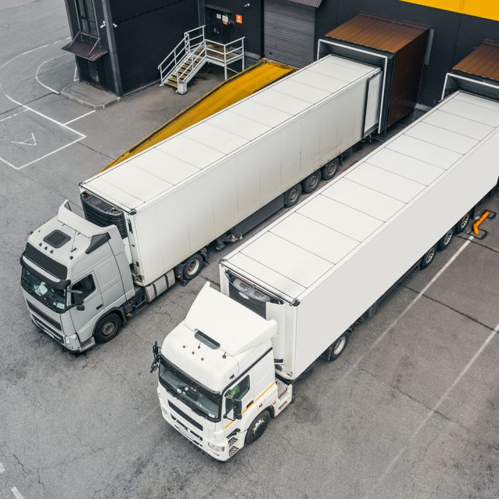 Two trucks loading in the distribution hub